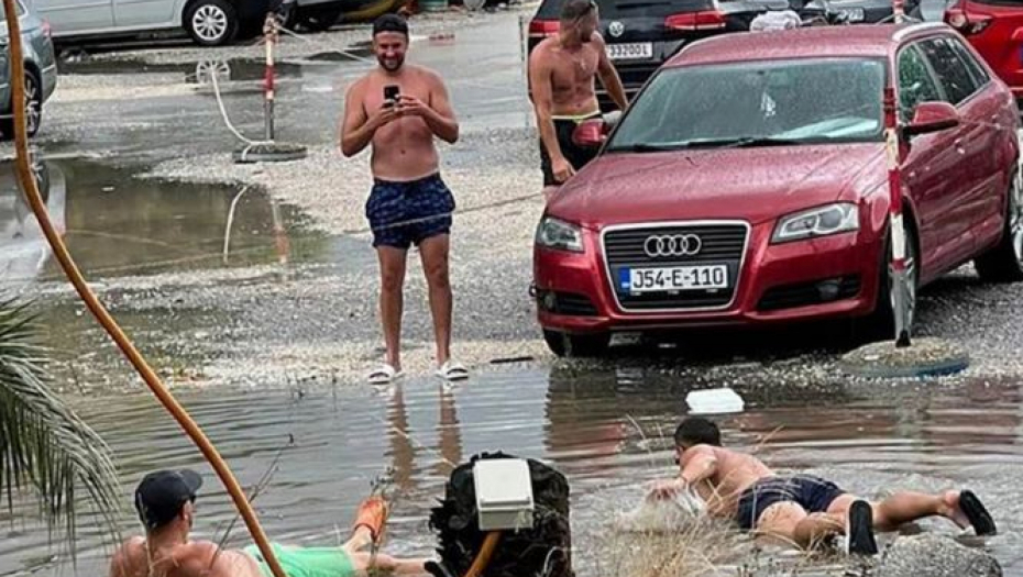 "IMA AJKULA, PAZITE SE"! Slika iz Igala zapalila region, turisti se kupaju na neverovatnom mestu usred nevremena (FOTO)